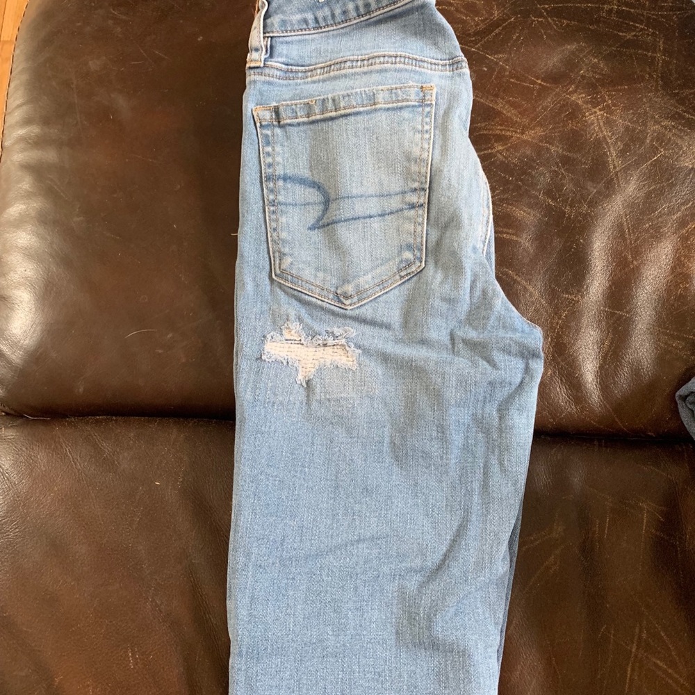 American Eagle medium wash covered ripped jeans